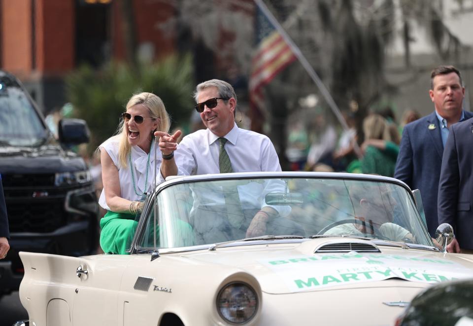 Governor Brian Kemp and his wife Marty ride in a classic Thunderbird during the Savannah St. Patrick's Day Parade on Saturday, March 16, 2024.