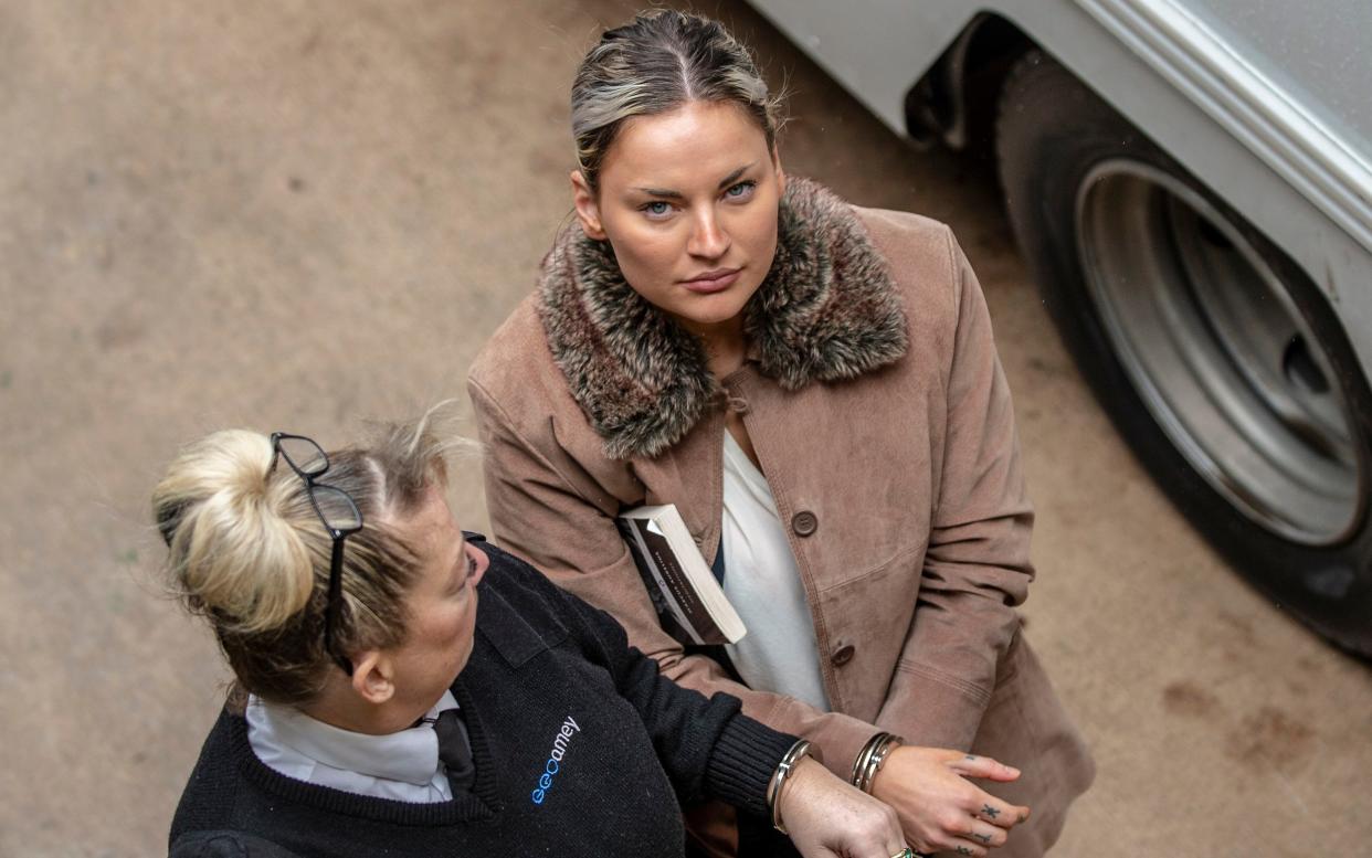 Alice Wood arriving in handcuffs for her trial at Chester Crown Court