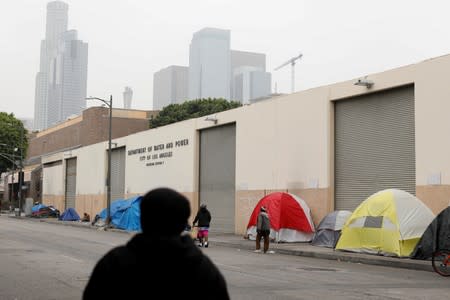 Tents and tarps erected by homeless people are shown along the sidewalks in the skid row area of downtown Los Angeles, California