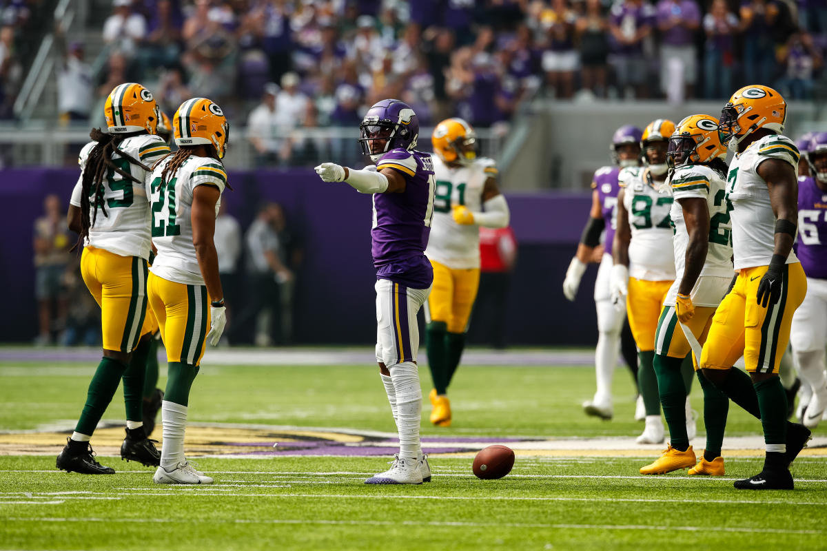 MINNEAPOLIS, MN - SEPTEMBER 11: Green Bay Packers quarterback Aaron Rodgers  (12) looks to pass during an NFL game between the Minnesota Vikings and  Green Bay Packers on September 11, 2022 at