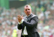 Celtic manager Brendan Rodgers applauds the fans at the end of the Scottish Premiership soccer match between Glasgow Rangers and Celtic Glasgow, at the Celtic Park, in Glasgow, Scotland, Saturday May 11, 2024. (Jane Barlow/PA via AP)