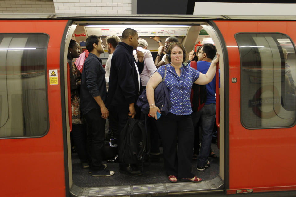 People in a Central Line underground train wait for the departure at Liverpool Street underground station in London, Friday, Aug. 3, 2012. Severe delays were reported Friday morning on the busy tube line serving some Olympics venues on the day that the athletics competition gets under way. (AP Photo/Sang Tan)