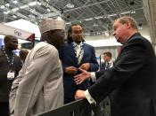 U.S. Assistant Secretary for Fossil Energy at the department of energy Steven Winberg speaks to former Nigerian President Olusegun Obasanjo at the Africa Oil Week conference in Cape Town