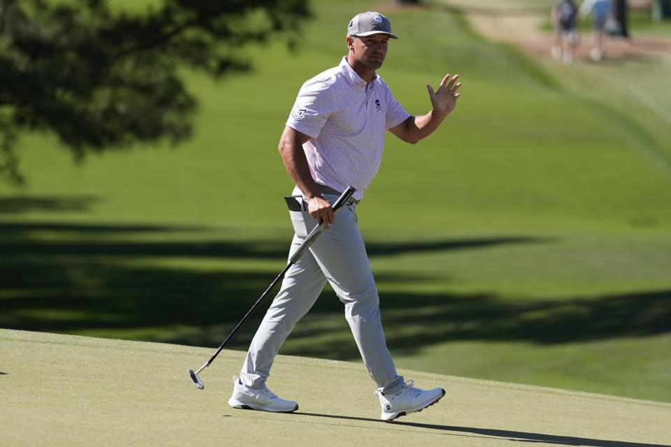 Bryson DeChambeau waves after making a putt on the seventh hole during third round at the Masters golf tournament at Augusta National Golf Club Saturday, April 13, 2024, in Augusta, Ga. (AP Photo/Ashley Landis)