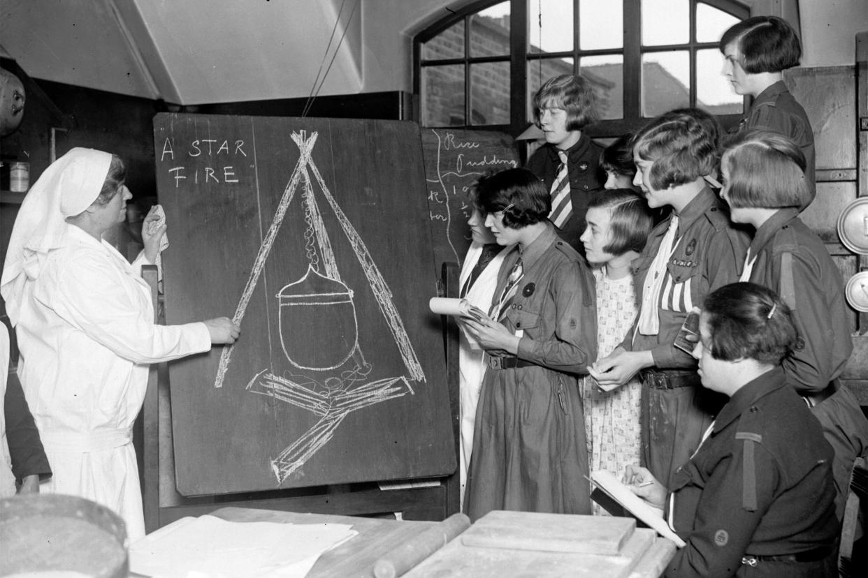 A cookery class for girl guides given by a nurse