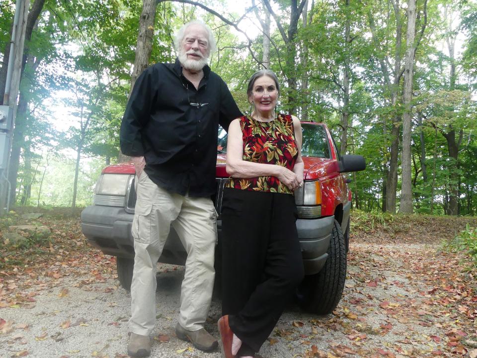 James Alexander Thom and his wife Dark Rain with their 1998 Jeep Cherokee at their Owen County home in 2017.