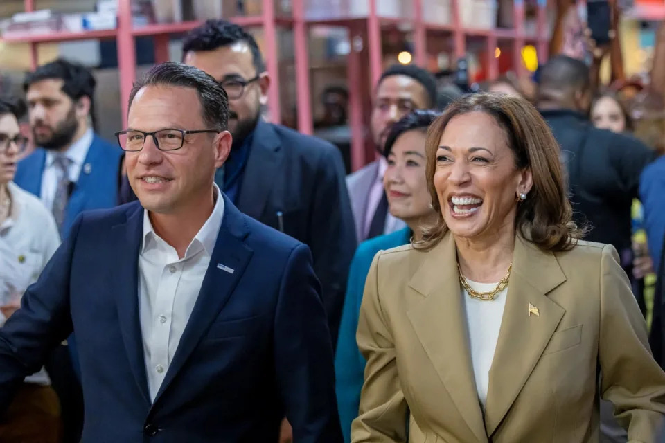 US vice president Kamala Harris and Pennsylvania governor Josh Shapiro visit the Reading Terminal Market in Philadelphia (REUTERS)