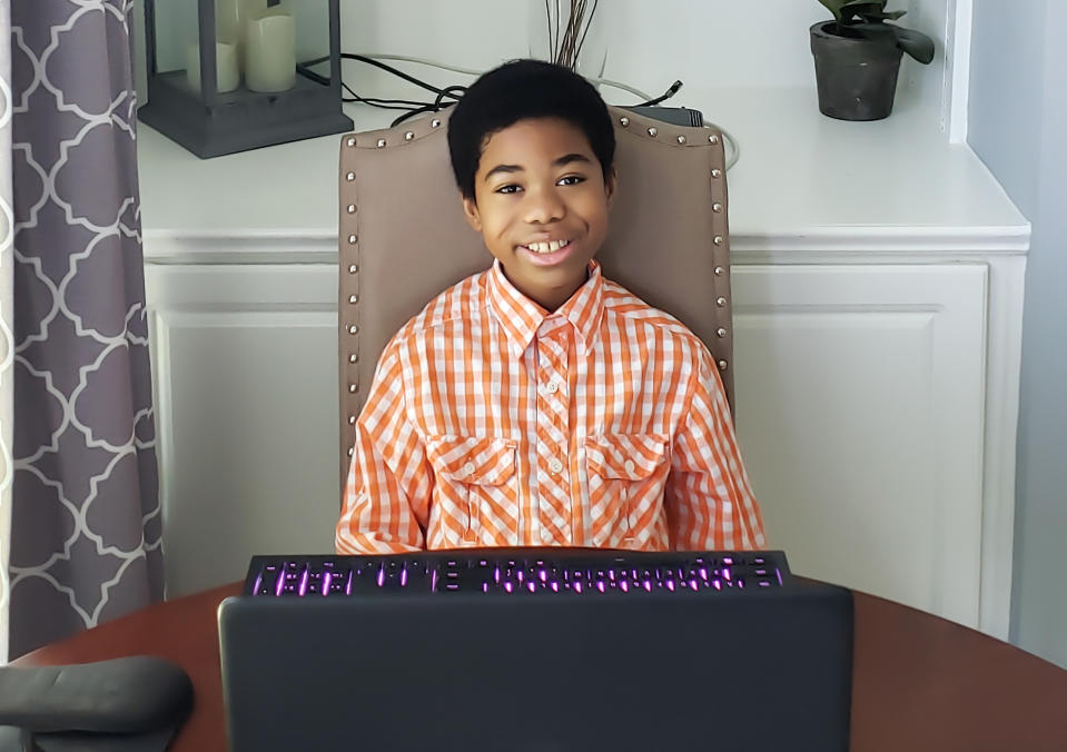 This image released by Ben Evans shows his son, 10-year-old Collier Evans in Alpharetta, Ga. Evans will attend school remotely when he begins fifth grade Aug. 17. He could have gone in person full time or picked a blended option but said he was anxious about returning to school. (Ben Evans via AP)