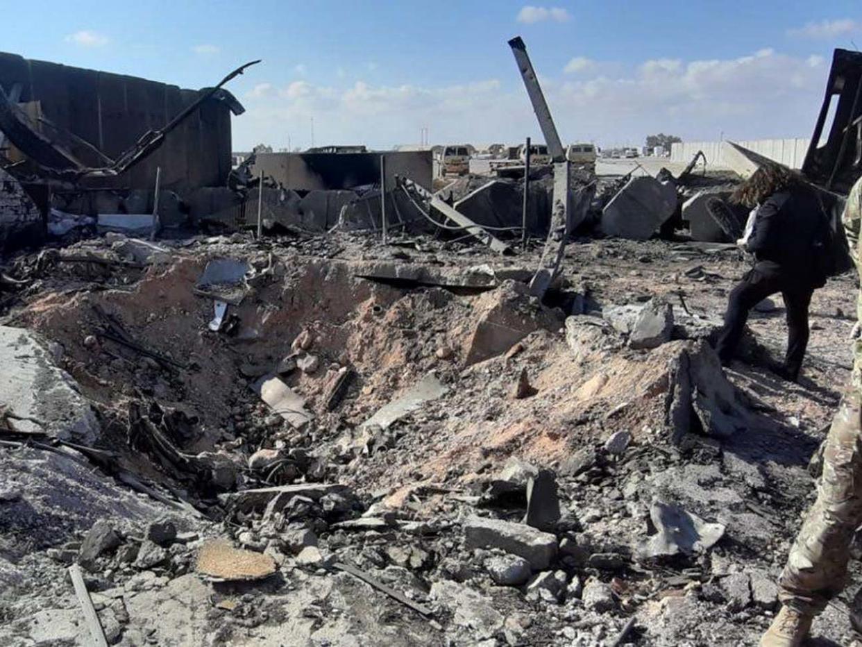 US soldiers stand next the damage that caused by the Iran's missiles attack inside Ain al-Assad air base in Anbar province, Iraq: EPA