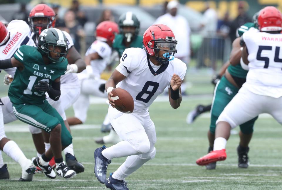 Southfield A&T quarterback Isaiah Marshall runs against Cass Tech during first half action Saturday, August 26, 2023.