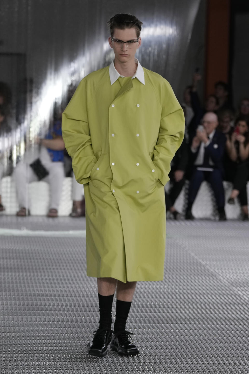 A model wears a creation as part of the Prada men's Spring Summer 2024 collection presented in Milan, Italy, Sunday, June 18, 2023. (AP Photo/Luca Bruno)