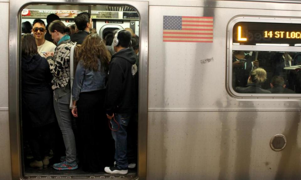 Passengers pack onto the L train in New York City. The number of daily commuters has reached 9 million. 