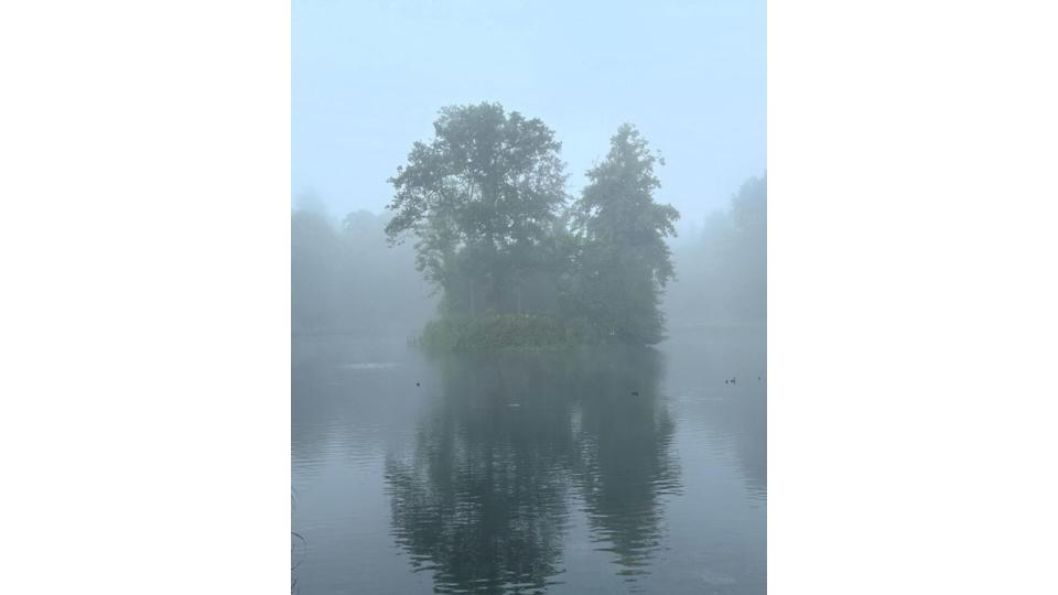 misty lake with island in centre