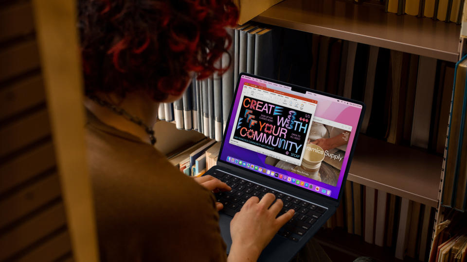 Apple student discounts: woman using Apple MacBook Air in library