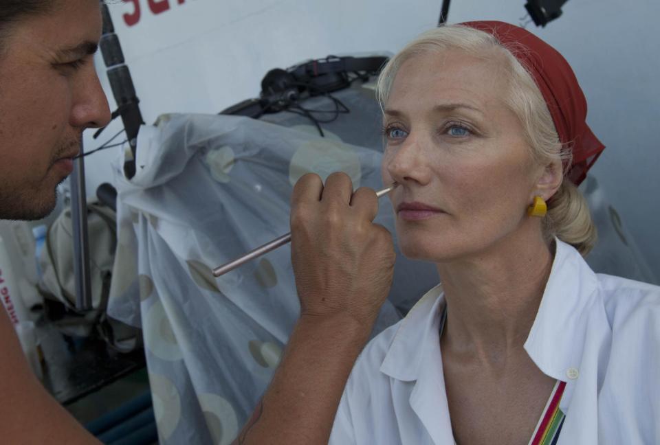 In this April 24, 2014 photo, actor Joely Richardson sits down to have her makeup applied during the shooting of the movie "Papa" in Havana Bay, Cuba. An international film crew has been re-enacting this and other historic scenes from the 1950s in the streets of Havana in recent weeks for "Papa," a biopic about the budding friendship between Hemingway and a young journalist in turbulent, pre-revolution Cuba. (AP Photo/Yesica Fish)