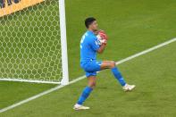 Morocco's goalkeeper Munir Mohamedi saves during the World Cup group F soccer match between Belgium and Morocco, at the Al Thumama Stadium in Doha, Qatar, Sunday, Nov. 27, 2022. (AP Photo/Pavel Golovkin)