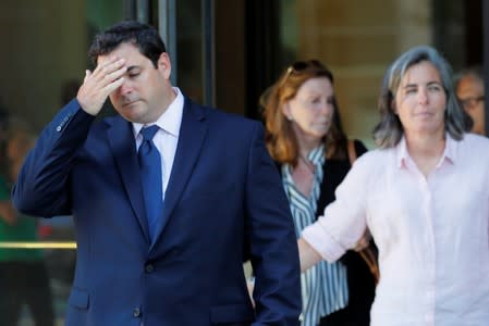 John Vandemoer, Stanford University's former head sailing coach, leaves the federal courthouse after being sentenced in Boston