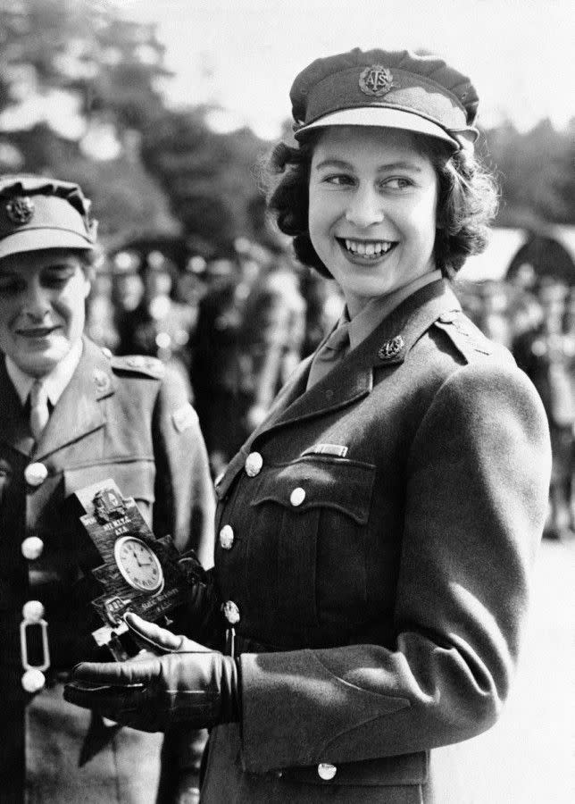 Ready to serve! During World War II, Princess Elizabeth joined the Women's Auxiliary Territorial Service where she was promoted to Junior Commander. In this photo, she is presented with a clock on Aug. 3, 1945 during a ceremony at the camp where she received her training.