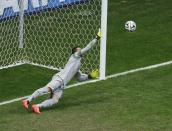 Brazil's goalkeeper Julio Cesar concedes a goal to Robin van Persie of the Netherlands (not pictured) during their 2014 World Cup third-place playoff at the Brasilia national stadium in Brasilia July 12, 2014. REUTERS/Ruben Sprich (BRAZIL - Tags: SOCCER SPORT WORLD CUP)