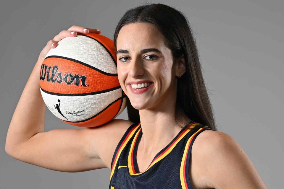 <p>Matt Kryger/NBAE via Getty</p> Caitlin Clark #22 of the Indiana Fever poses for a portrait