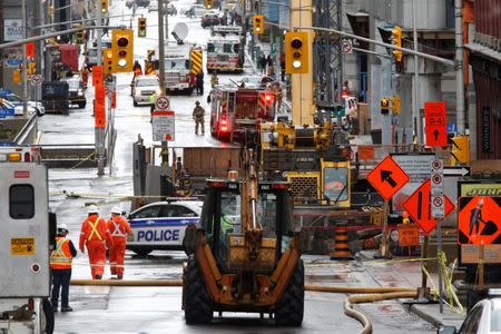 Emergency personnel and workers are pictured at the scene of a gas leak in downtown Ottawa, Ontario, Canada, May 2, 2017. REUTERS/Chris Wattie