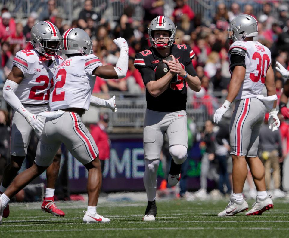 Ohio State quarterback Devin Brown runs for yardage in Saturday's spring game.