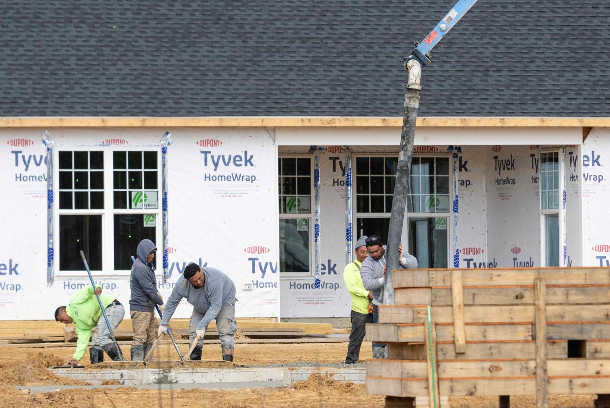 Workers lay a foundation at a new home construction site in Trappe, Maryland, on October 28, 2022. - New home sales in the US dipped in September, official data showed on October 26, 2022, as worsening affordability nudges ownership further out of reach for many. Sales soared during the coronavirus pandemic as Americans snapped up homes on the back of bargain mortgage rates, but the sector has cooled with the US Federal Reserve hiking lending rates as it fights to bring down surging inflation. (Photo by Jim WATSON / AFP) (Photo by JIM WATSON/AFP via Getty Images)