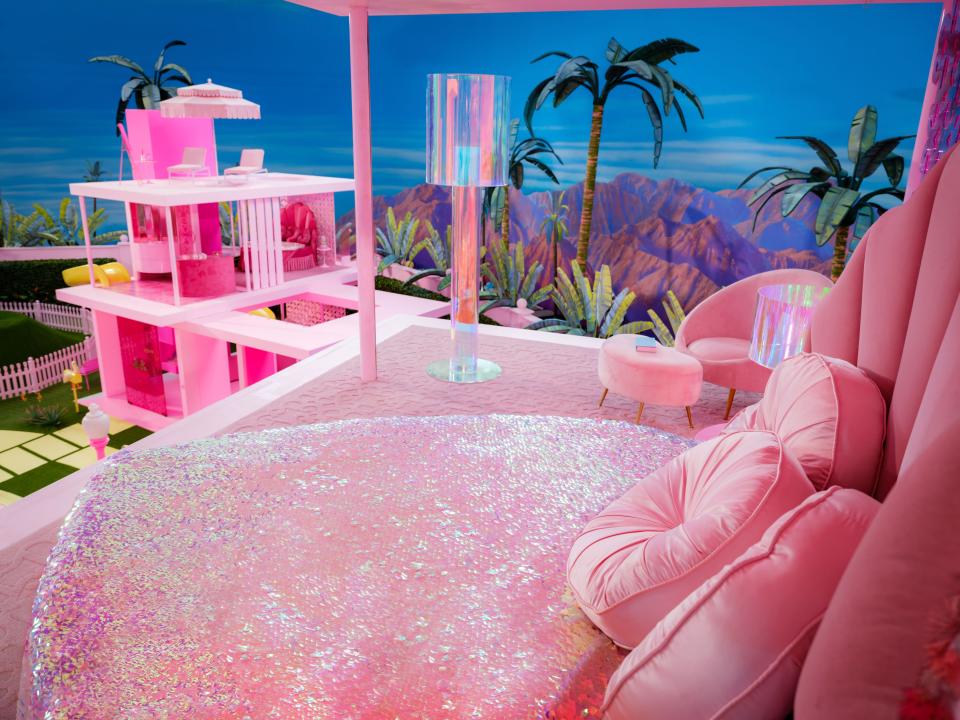Barbie's bedroom features a heart-shaped bed dressed in a sequin blanket.