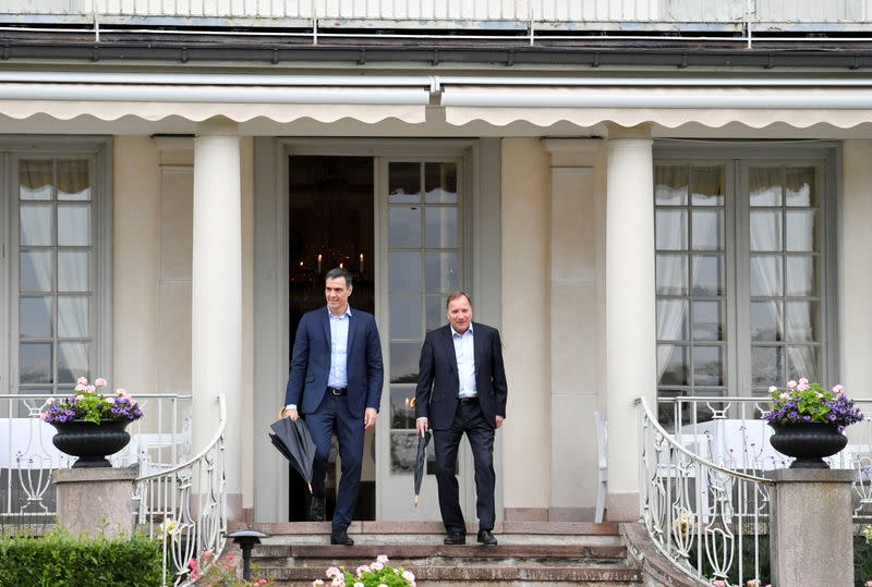 Spanish Prime Minister Pedro Sanchez and Sweden's Prime Minister Stefan Lofven walk during their meeting in Harpsund