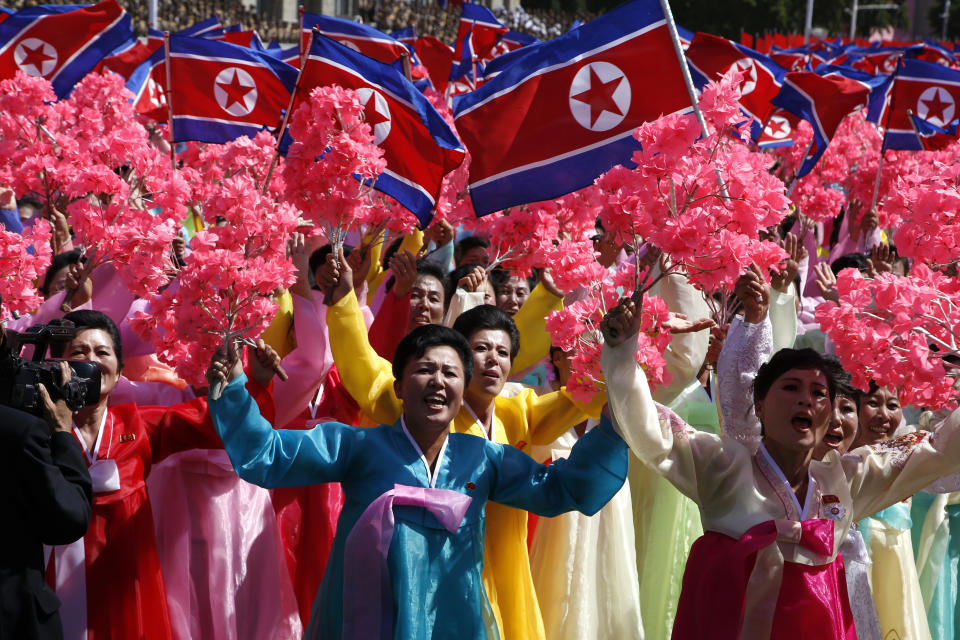Participants cheer as they take part in a parade for the 70th anniversary of North Korea's founding day in Pyongyang, North Korea, Sunday, Sept. 9, 2018. North Korea staged a major military parade, huge rallies and will revive its iconic mass games on Sunday to mark its 70th anniversary as a nation. (AP Photo/Ng Han Guan)
