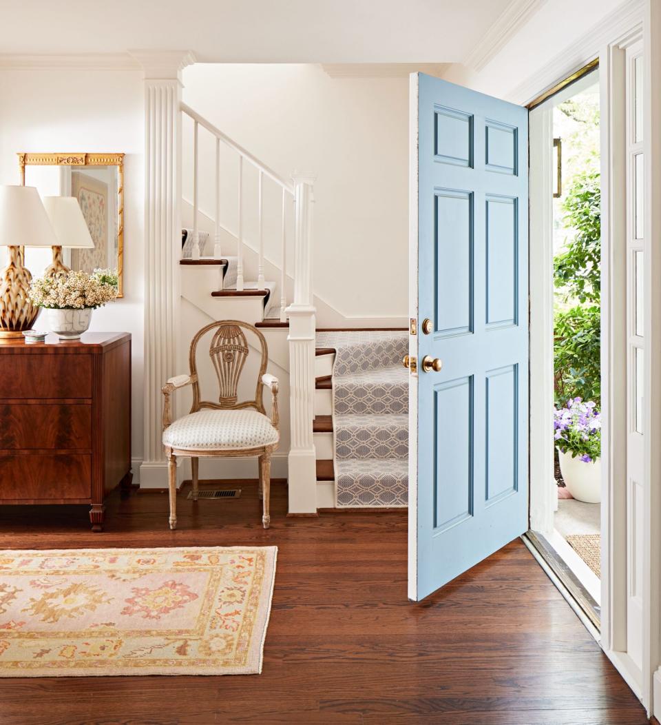 Amy Berry Designed Dallas House Neutral Entryway with Blue Front Door