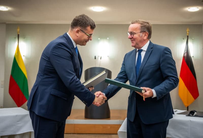 Boris Pistorius (R), German Minister of Defence, takes part in the signing of the intergovernmental agreement on the deployment of the Lithuanian brigade, together with Laurynas Kasciunas, Lithuanian Minister of Defence. The agreement regulates the status of the brigade and the legal status of the Bundeswehr soldiers deployed in the NATO country, which is to be ready for combat in 2027. Michael Kappeler/dpa