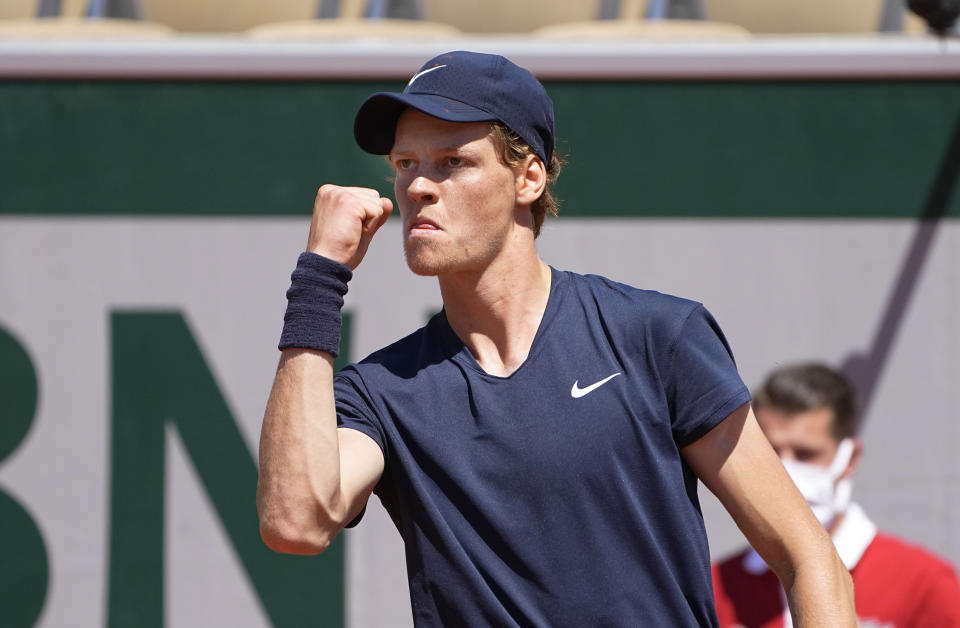 Italy's Jannik Sinner pcelebrates after winning a point against Pierre-Hugues Herbert of France during their first round match on day two of the French Open tennis tournament at Roland Garros in Paris, France, Monday, May 31, 2021. (AP Photo/Michel Euler)