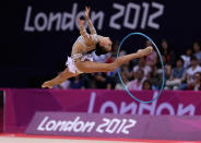 LONDON, ENGLAND - AUGUST 09: Daria Dmitrieva of Russia performs with the hoop during the Rhythmic Gymnastics qualification on Day 13 of the London 2012 Olympics Games at Wembley Arena on August 9, 2012 in London, England. (Photo by Julian Finney/Getty Images)