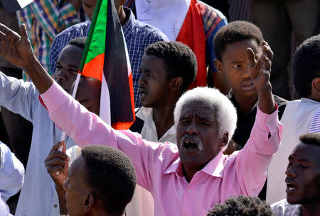 A Sudanese demonstrator celebrates after Defence Minister Awad Ibn Auf stepped down as head of the country's transitional ruling military council, as protesters demanded quicker political change, near the Defence Ministry in Khartoum, Sudan April 13, 2019. REUTERS/Stringer