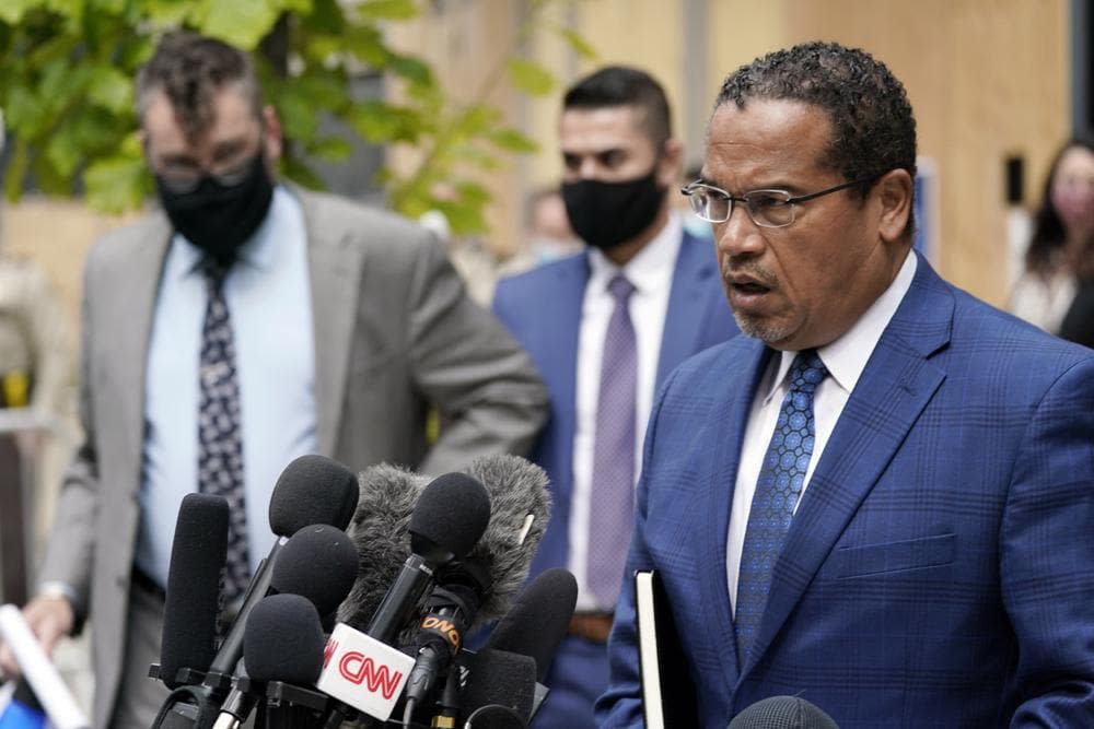 In this Sept. 11, 2020, file photo, Minnesota Attorney General Keith Ellison, right, addresses reporters outside the Hennepin County Family Justice Center in Minneapolis. (AP Photo/Jim Mone, File)