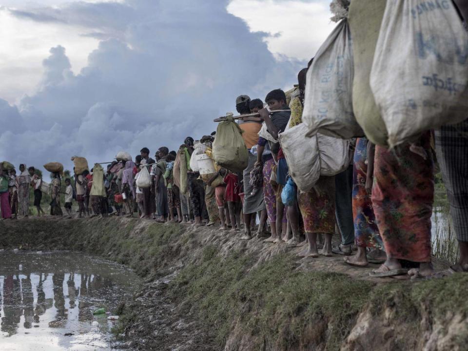 Rohingya refugees after crossing the Naf river from Myanmar into Whaikhyang in Bangladesh (Getty)