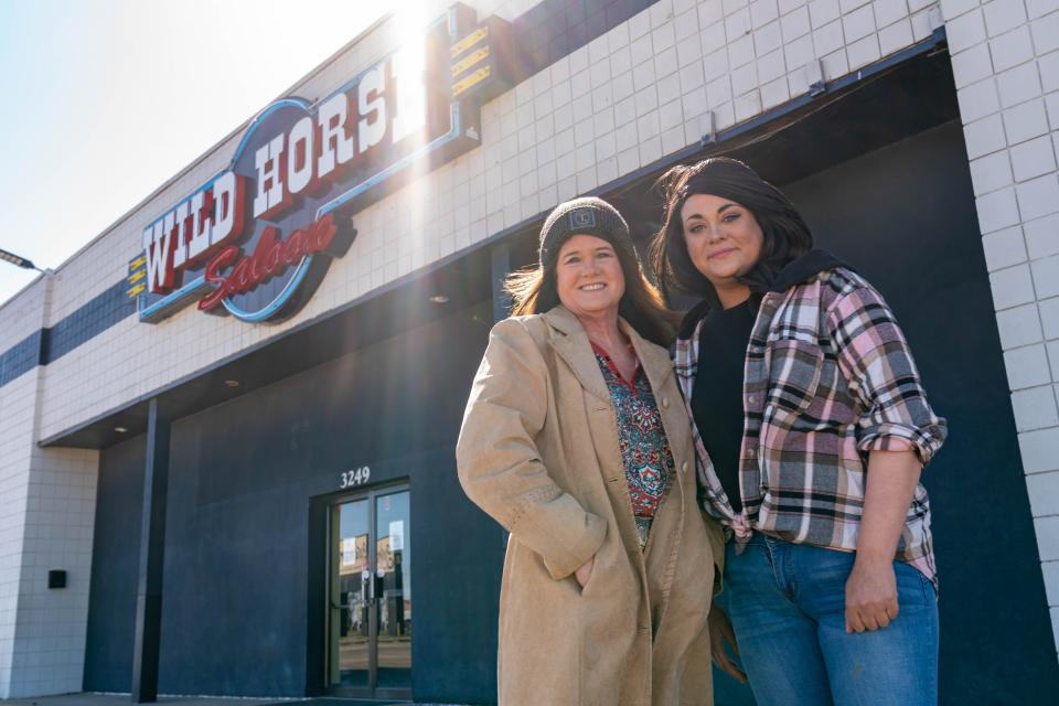 The new owner of Wild Horse Saloon, 3249 S.W. Topeka Blvd., Julie Pamplin Castaneda, left, poses with her daughter and soon-to-be general manager, Rikae Garcia, right, Saturday morning.