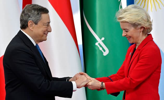 Italy's Prime Minister, Mario Draghi (L) greets President of the European Commission Ursula von der Leyen as she arrives for the G20 of World Leaders Summit on October 30, 2021 at the convention center 