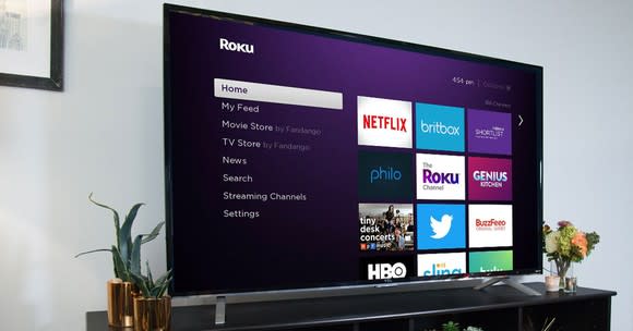 A TV displaying the Roku home screen.