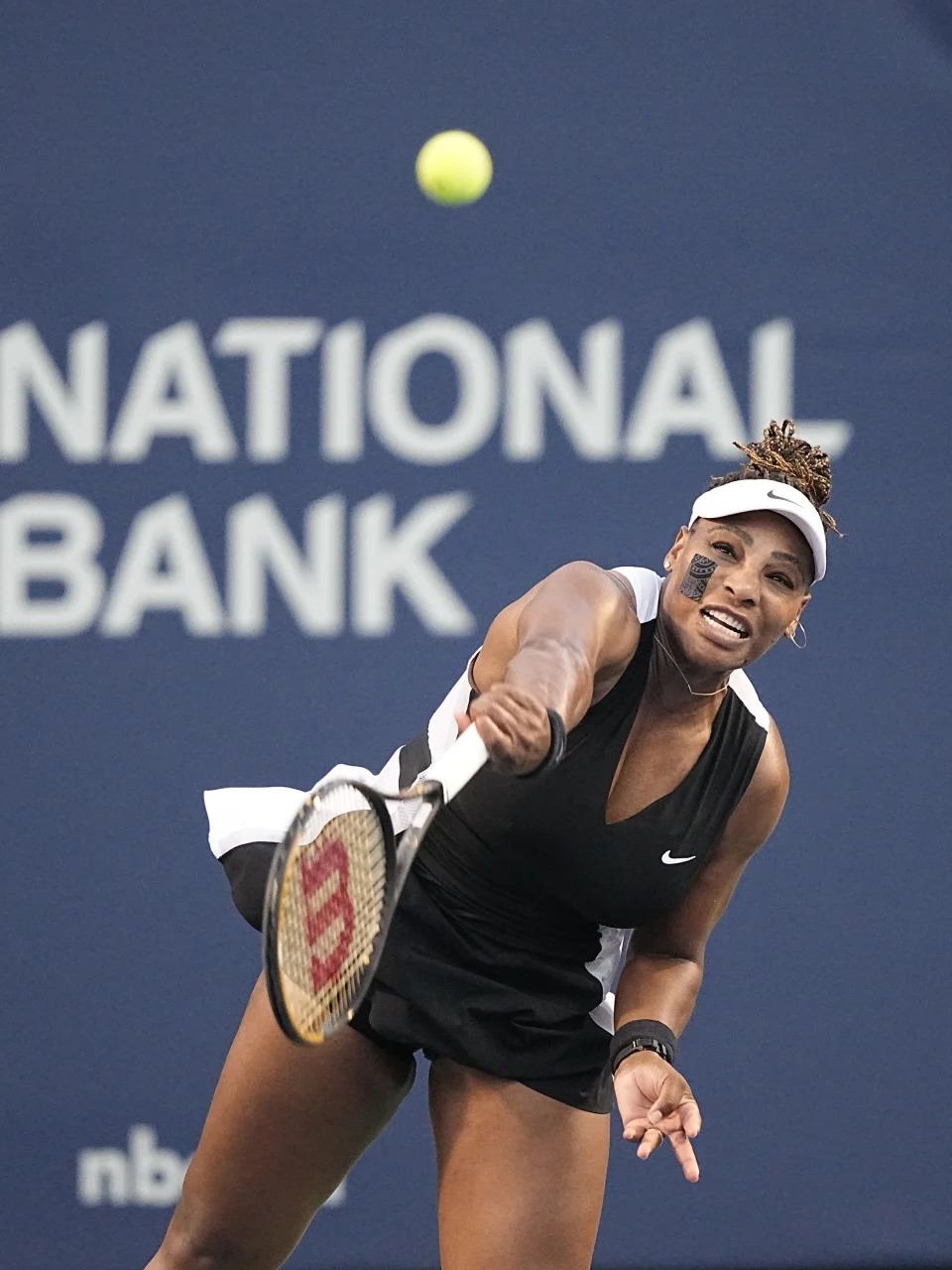 Aug 10, 2022; Toronto, ON, Canada; Serena Williams (USA) serves to Belinda Bencic (not pictured) at Sobeys Stadium. Mandatory Credit: John E. Sokolowski-USA TODAY Sports