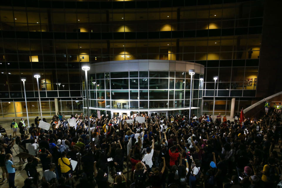 <p>Demonstrators gather at the Atlanta Police Department headquarters during a protest in Atlanta on Friday, Sept. 23, 2016 in response to the police shooting deaths of Terence Crutch in Tulsa, Okla. and Keith Lamont Scott in Charlotte, N.C. (AP Photo/Branden Camp)</p>