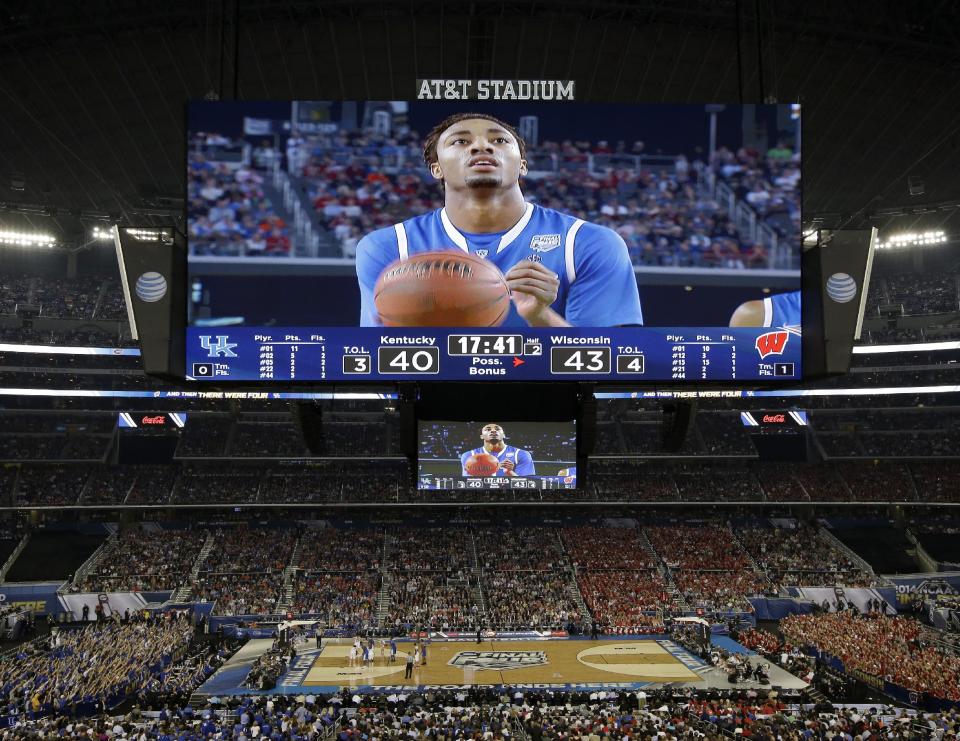 Kentucky guard James Young takes a foul shot against Wisconsin during the second half of the NCAA Final Four tournament college basketball semifinal game Saturday, April 5, 2014, in Arlington, Texas. (AP Photo/Tony Gutierrez)