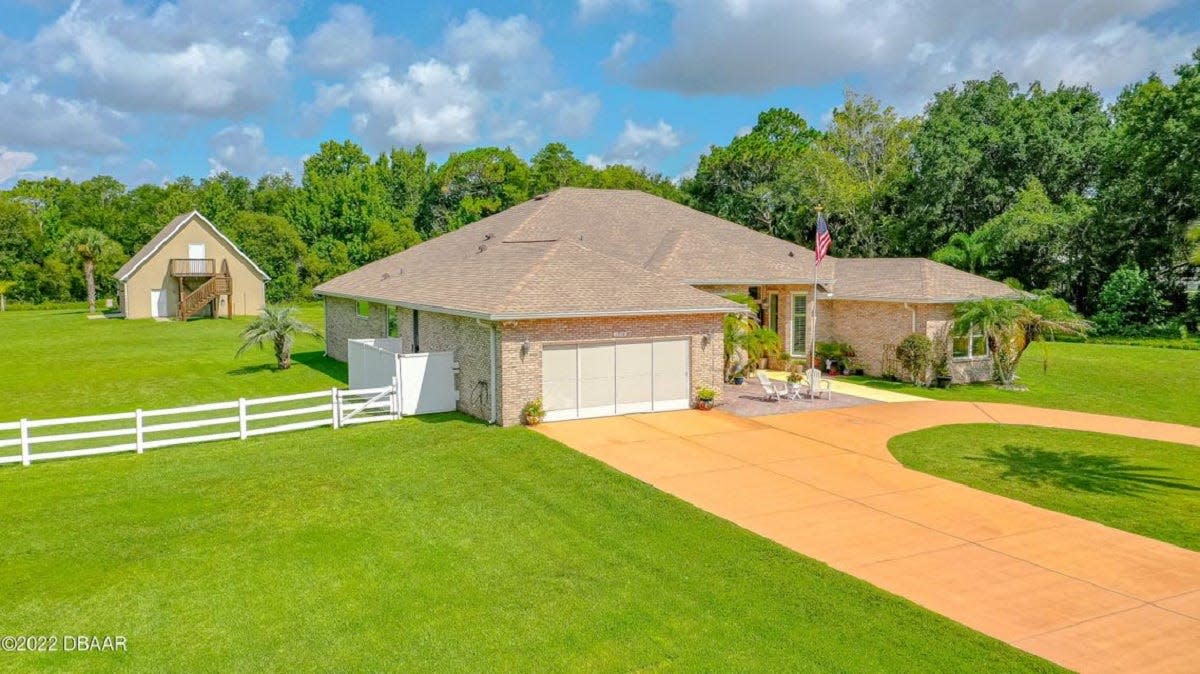 This amazing four-bedroom, three-bath, two-car-garage brick pool home sits on three acres in Port Orange and is about as centrally located as you can get while still living in the country.