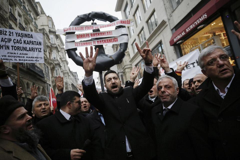 Supporters of Turkey's President Recep Tayyip Erdogan walk to the Dutch consulate in Istanbul, Saturday, March 11, 2017. Turkey and the Netherlands sharply escalated a dispute between the two NATO allies on Saturday as the Dutch withdrew landing permission for the Turkish foreign minister's aircraft, drawing Turkish President Recep Tayyip Erdogan to call them "fascists." (AP Photo/ Emrah Gurel)