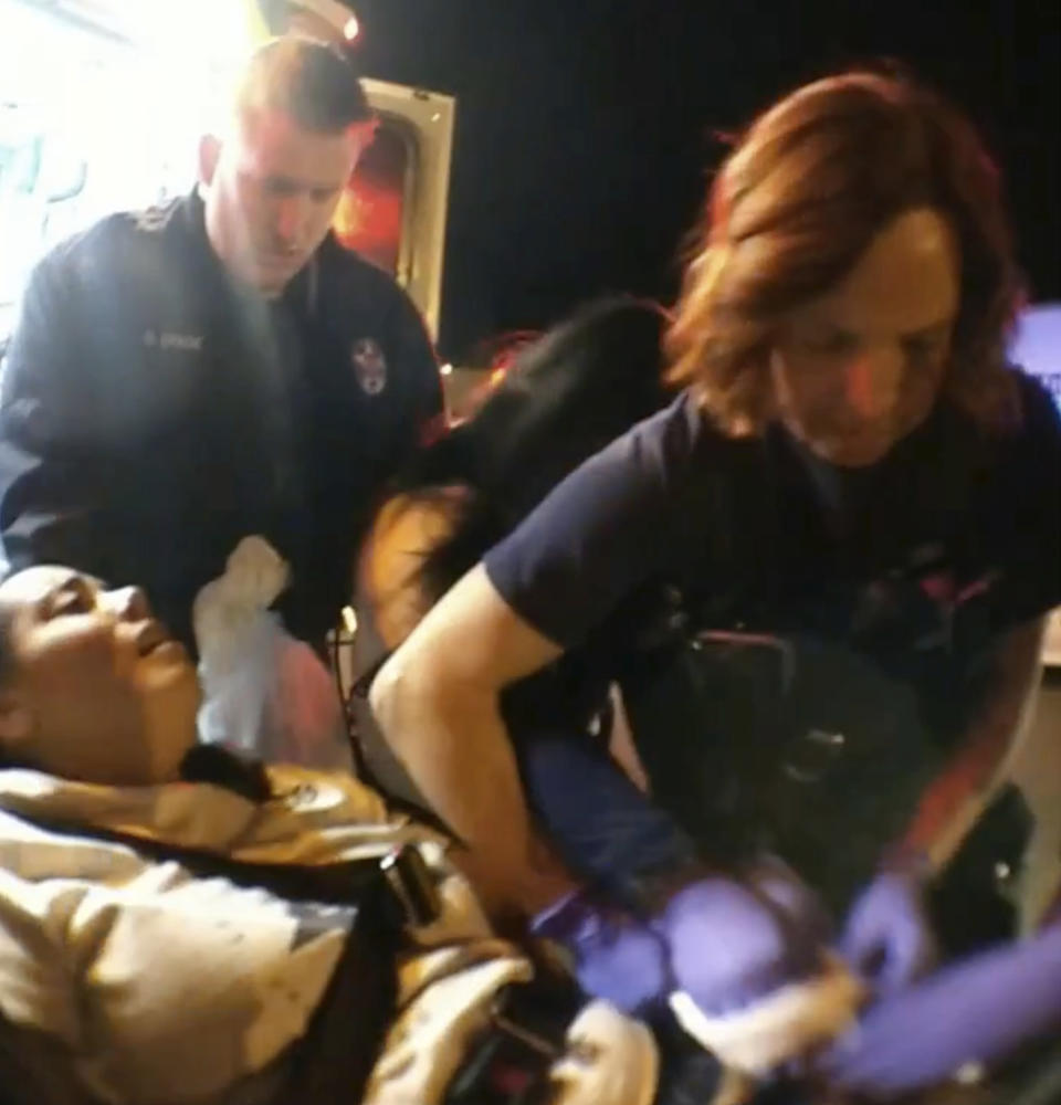 In this image from El Paso County Sheriff's Office body-camera video, Jerica LaCour is restrained on a gurney in Colorado Springs, Colo., on Jan. 11, 2018. "Guess who gets ketamine?" paramedic Jason Poulson of AMR, the nation's largest ambulance company, said. AMR and Poulson deny responsibility for LaCour’s death in her family’s pending lawsuit, arguing LaCour was experiencing excited delirium and ketamine was appropriate. (El Paso County Sheriff's Office via AP)