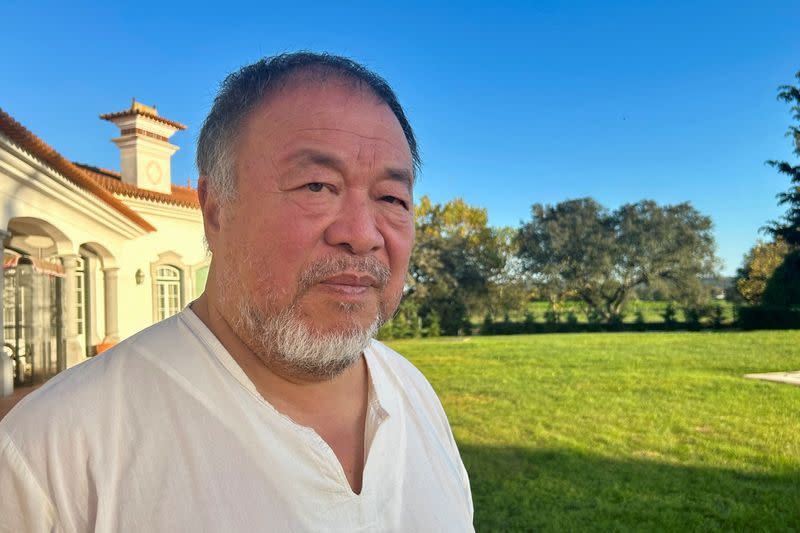 Chinese dissident artist Ai Weiwei poses for a picture after an interview with Reuters in Montemor-O-Novo