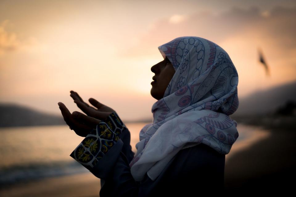 what is ramadan muslim woman at sunset on beach