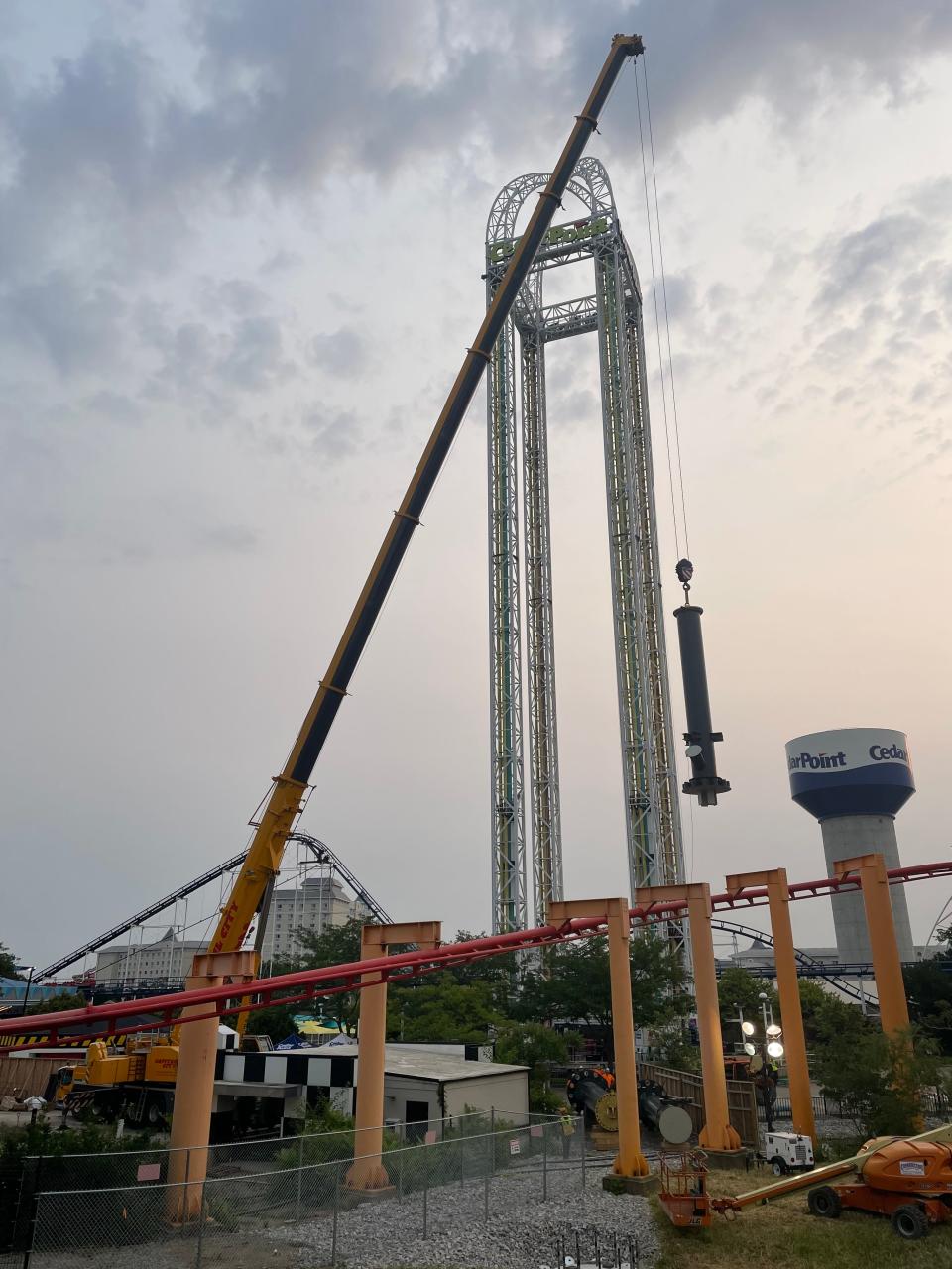 A large crane lifts the first piece of the new second 420-foot-tall tower that will be part of Cedar Point's Top Thrill 2 coaster.