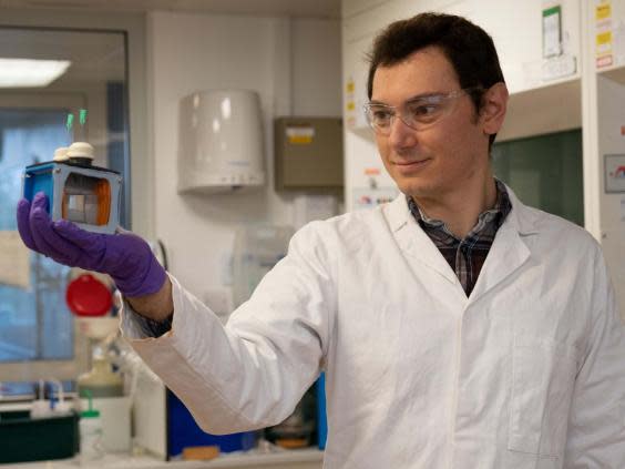 The device, held by Virgil Andrei, still works efficiently on cloudy or rainy days (Chanon Pornrungrog/Cambridge University/PA)